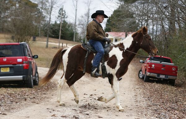 U.S. Senate Republican candidate Roy Moore rides a horse to vote, Tuesday, Dec. 12, 2017, in Gallant, Ala. U.S. Senate Republican candidate Roy Moore rides a horse to vote, Tuesday, Dec. 12, 2017, in Gallant, Ala. - Sputnik International