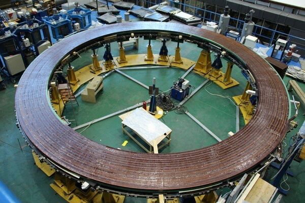 At the Srednenevsky Shipbuilding Plant in Saint Petersburg, Russia, specialists are winding the double pancakes for ITER's smallest poloidal field coil, PF1. Pictured is the first-completed double pancake after vacuum pressure impregnation with epoxy resin. At the Srednenevsky Shipbuilding Plant in Saint Petersburg, Russia, specialists are winding the double pancakes for ITER's smallest poloidal field coil, PF1. Pictured is the first-completed double pancake after vacuum pressure impregnation with epoxy resin. - Sputnik International