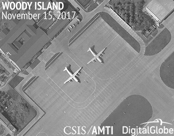 This image provided by CSIS Asia Maritime Transparency Initiative/DigitalGlobe shows a satellite image of Woody Island in the Paracel island chain in the South China Sea taken Nov. 15, 2017, and annotated by the source, showing two Chinese Y-8 military transport aircraft This image provided by CSIS Asia Maritime Transparency Initiative/DigitalGlobe shows a satellite image of Woody Island in the Paracel island chain in the South China Sea taken Nov. 15, 2017, and annotated by the source, showing two Chinese Y-8 military transport aircraft - Sputnik International