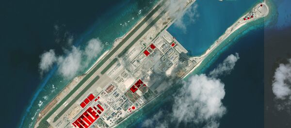 This image provided by CSIS Asia Maritime Transparency Initiative/DigitalGlobe shows a satellite image of Fiery Cross Reef in Spratly island chain in the South China Sea, annotated by the source to show areas where China has conducted construction work above ground during 2017 - Sputnik International