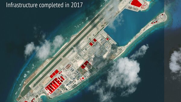 This image provided by CSIS Asia Maritime Transparency Initiative/DigitalGlobe shows a satellite image of Fiery Cross Reef in Spratly island chain in the South China Sea, annotated by the source to show areas where China has conducted construction work above ground during 2017 - Sputnik International