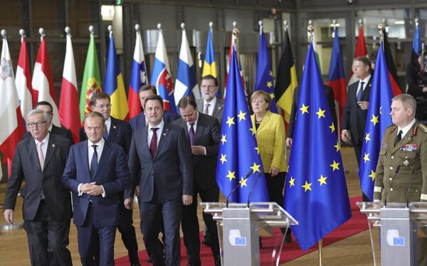 European Council President Donald Tusk, front center, and European Commission President Jean-Claude Juncker, front left, lead EU leaders to a group photo at an EU summit at the Europa building in Brussels on Thursday, Dec. 14, 2017 European Council President Donald Tusk, front center, and European Commission President Jean-Claude Juncker, front left, lead EU leaders to a group photo at an EU summit at the Europa building in Brussels on Thursday, Dec. 14, 2017 - Sputnik International