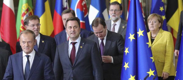 European Council President Donald Tusk, front center, and European Commission President Jean-Claude Juncker, front left, lead EU leaders to a group photo at an EU summit at the Europa building in Brussels on Thursday, Dec. 14, 2017 European Council President Donald Tusk, front center, and European Commission President Jean-Claude Juncker, front left, lead EU leaders to a group photo at an EU summit at the Europa building in Brussels on Thursday, Dec. 14, 2017 - Sputnik International
