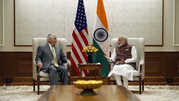 US Secretary of State Rex Tillerson (L) listens to Indian Prime Minister Narendra Modi at the Prime Minister's residence in New Delhi - Sputnik International
