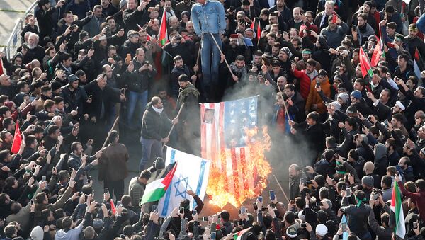 Demonstrators set U.S. and Israeli flags on fire during a protest against U.S. President Donald Trump's recognition of Jerusalem as Israel's capital, in Istanbul, Turkey December 10, 2017 - Sputnik International