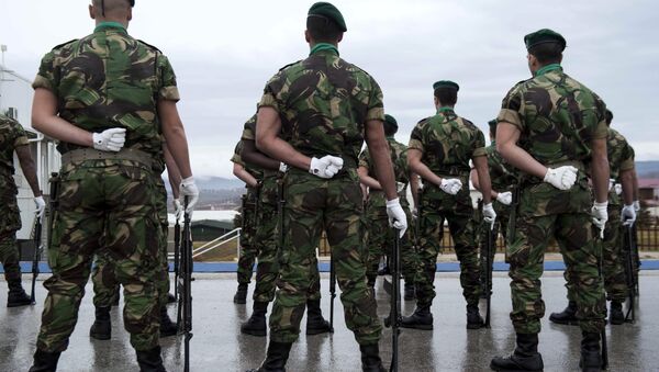 Portuguese soldiers serving in the North Atlantic Treaty Organization (NATO) led peacekeeping mission in Kosovo (KFOR) stand at attention before the arrival of the NATO secretary general during his visit to Pristina on January 23, 2015 - Sputnik International
