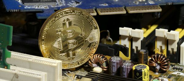 A copy of bitcoin standing on PC motherboard is seen in this illustration picture, October 26, 2017 A copy of bitcoin standing on PC motherboard is seen in this illustration picture, October 26, 2017 - Sputnik International