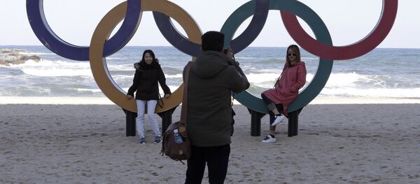 This Oct. 30, 2017, photo show visitors posing with the Olympic Rings at the Gyeongpodae beach, in Gangneung, South Korea This Oct. 30, 2017, photo show visitors posing with the Olympic Rings at the Gyeongpodae beach, in Gangneung, South Korea - Sputnik International