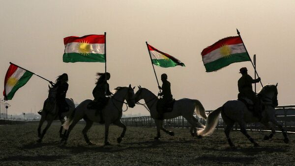 Iraqi Kurdish horsemen ride carrying Kurdish flags celebrating their flag day in the northern city of Arbil, the capital of the autonomous Kurdish region in northern Iraq - Sputnik International