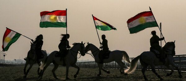 Iraqi Kurdish horsemen ride carrying Kurdish flags celebrating their flag day in the northern city of Arbil, the capital of the autonomous Kurdish region in northern Iraq - Sputnik International