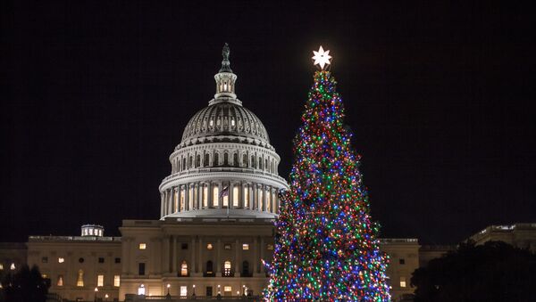 The Capitol Christmas tree is illuminated as lawmakers in the Senate work late into the evening on the Republican tax bill, in Washington, Tuesday, Dec. 19, 2017 - Sputnik International