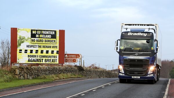 Traffic passing a Brexit Border poster on the Dublin road Co Armagh border, between Newry in Northern Ireland and Dundalk in the Irish Republic - Sputnik International