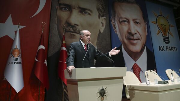 Backdropped by posters of Turkey's founding father Mustafa Kemal Ataturk, left, and himself, Turkey's President Recep Tayyip Erdogan addresses provincial leaders of his ruling Justice and Development Party (AKP), in Ankara, Turkey, Friday, Nov. 17, 2017 - Sputnik International