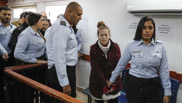 Ahed Tamimi (2nd-R), a prominent 17-year-old Palestinian campaigner against Israel's occupation, appears at a military court at the Israeli-run Ofer prison in the West Bank village of Betunia on December 25, 2017 - Sputnik International