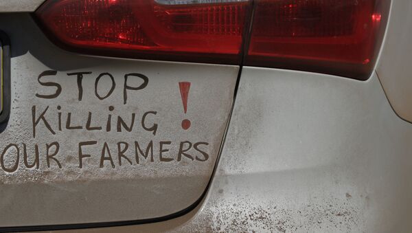 A bumper sign during a blockade of the freeway between Johannesburg and Vereeniging, in Midvaal, South Africa, in protest against the recent murder of farmers, Monday, Oct 30 2017 - Sputnik International
