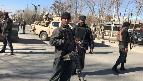 Afghan policemen stand guard at the site of a blast in Kabul, Afghanistan December 28, 2017 - Sputnik International