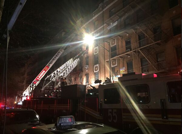 New York Fire Department ladder trucks deploy at a building fire in the Bronx borough of New York City New York Fire Department ladder trucks deploy at a building fire in the Bronx borough of New York City - Sputnik International