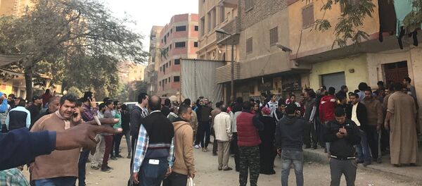 People are seen outside the Mar Mina Church after a blast, in Helwan district on the outskirts of Cairo, Egypt after a blast December 29, 2017 People are seen outside the Mar Mina Church after a blast, in Helwan district on the outskirts of Cairo, Egypt after a blast December 29, 2017 - Sputnik International
