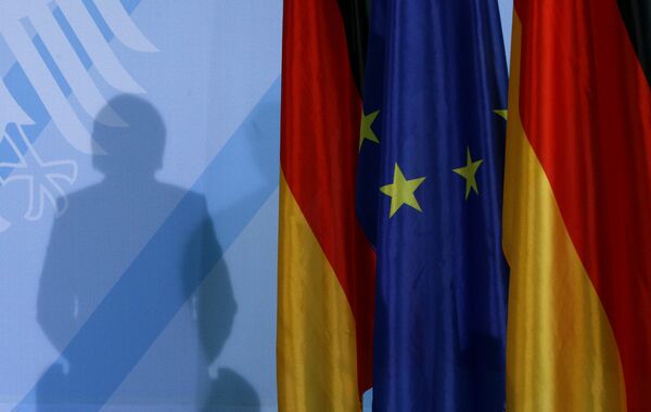The shadow of German Chancellor Angela Merkel photographed as she addresses the media after a meeting with German parliament floor leaders about the European Union bail-out in Berlin, Monday, May 10, 2010. - Sputnik International