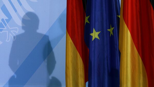 The shadow of German Chancellor Angela Merkel photographed as she addresses the media after a meeting with German parliament floor leaders about the European Union bail-out in Berlin, Monday, May 10, 2010. - Sputnik International