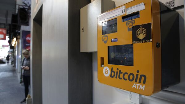 A Bitcoin ATM is placed in a public area in Hong Kong, Thursday, Dec. 21, 2017. Bitcoin is the world's most popular virtual currency. Such currencies are not tied to a bank or government and allow users to spend money anonymously. They are basically lines of computer code that are digitally signed each time they are traded. - Sputnik International