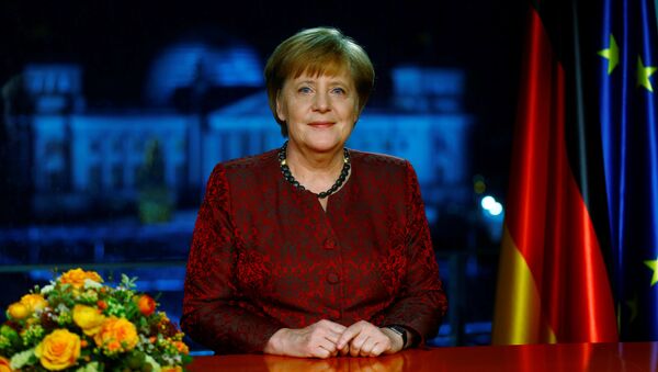 German acting Chancellor Angela Merkel poses for photographs after the television recording of her annual New Year's speech at the Chancellery in Berlin, Germany, December 30, 2017 - Sputnik International