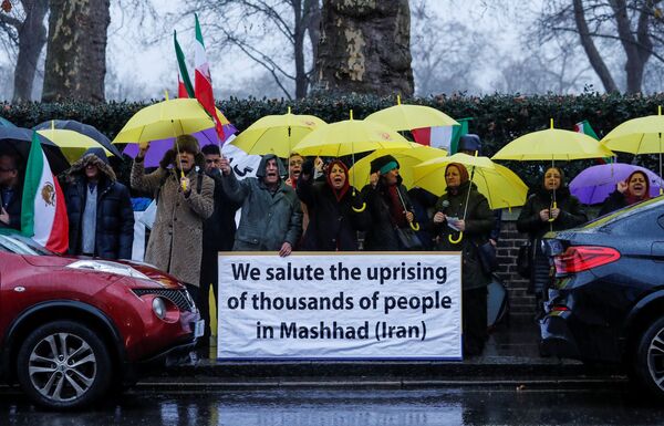 Opponents of Iranian President Hassan Rouhani hold a protest outside the Iranian embassy in west London, Britain December 31, 2017 Opponents of Iranian President Hassan Rouhani hold a protest outside the Iranian embassy in west London, Britain December 31, 2017 - Sputnik International