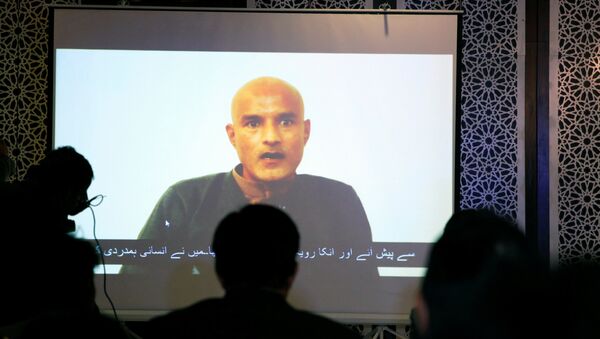 Former Indian navy officer Kulbhushan Sudhir Jadhav is seen on a screen during a news conference at the Ministry of Foreign Affairs in Islamabad, Pakistan December 25, 2017 - Sputnik International