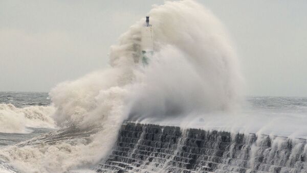 Waves crash over the stone jetty wall in Aberystwyth in west Wales as Storm Eleanor lashed Britain with violent storm-force winds of up to 100mph, leaving thousands of homes without power and hitting transport links Wednesday Jan. 3, 2018 - Sputnik International