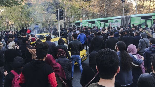 This photo taken by an individual not employed by the Associated Press and obtained by the AP outside Iran, demonstrators attend a protest over Iran's weak economy, in Tehran, Iran, Saturday, Dec. 30, 2017 - Sputnik International