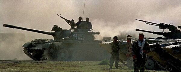 Northern alliance armor warm up their engines, during preparations for an offensive against Afghanistan's Taliban movement in Takhar province, some 15 km (9 miles) from the Tajik-Afghan border in Afghanistan, Thursday, Oct. 4, 2001. The opposition alliance in northern Afghanistan is coordinating its offensive with the United States, an opposition spokesman said Wednesday, and it is expecting fresh arms deliveries from two of its strongest allies in the fight against the Taliban: Iran and Russia. - Sputnik International