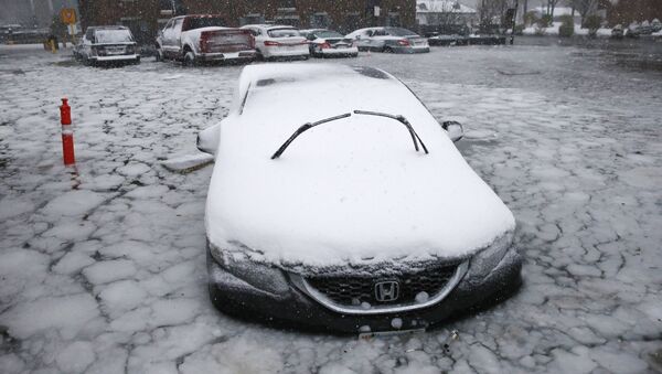 car sits in floodwaters from Boston Harbor on Long Wharf in Boston, Thursday, Jan. 4, 2018. A massive winter storm swept from the Carolinas to Maine on Thursday, dumping snow along the coast and bringing strong winds that will usher in possible record-breaking cold. - Sputnik International