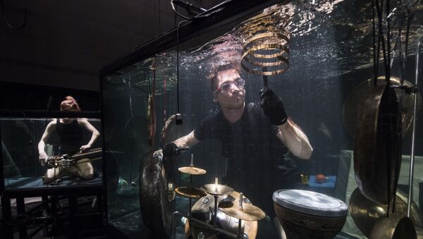 Members of the Between Music band, perform with custom-made instruments in a glass water tank during a rehearsal ahead of the AquaSonic underwater concert on April 19, 2017 in Aarhus, Denmark - Sputnik International
