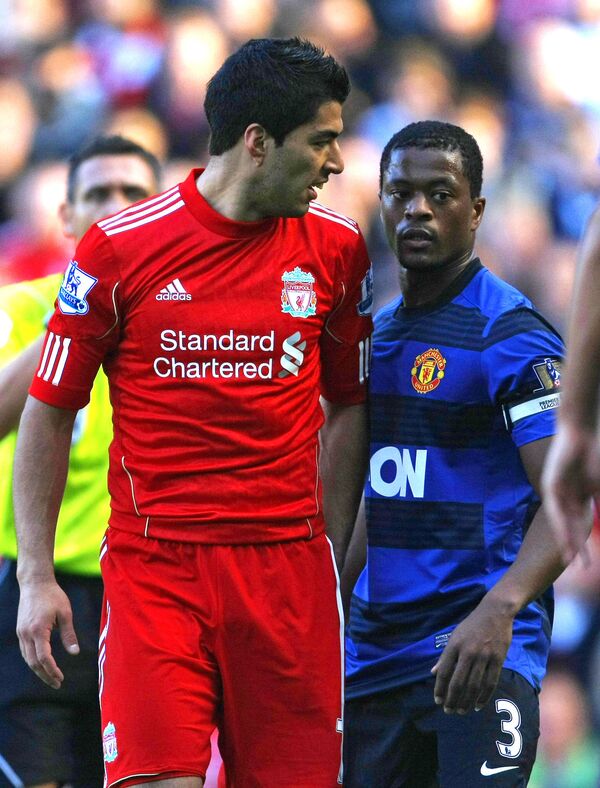 In this Oct. 15, 2011 file photo, Manchester United's Patrice Evra argues with Liverpool's Luis Suarez, left, during their English Premier League soccer match at Anfield, Liverpool, England In this Oct. 15, 2011 file photo, Manchester United's Patrice Evra argues with Liverpool's Luis Suarez, left, during their English Premier League soccer match at Anfield, Liverpool, England - Sputnik International