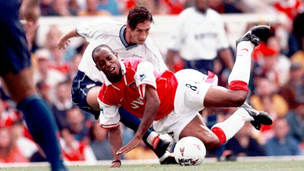 Arsenal's Ian Wright (8) is fouled by Justin Edinburgh of Tottenham Hotspur, during their FA Premier League match at Highbury, London Saturday Aug. 30, 1997 - Sputnik International