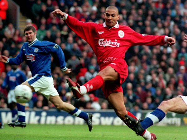 Liverpool's Stan Collymore volleys a shot at goal during the Premiership match against Leicester City at Anfield, Liverpool, Thursday, Dec. 26, 1996 Liverpool's Stan Collymore volleys a shot at goal during the Premiership match against Leicester City at Anfield, Liverpool, Thursday, Dec. 26, 1996 - Sputnik International