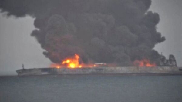 Smoke and fire is seen from Panama-registered tanker SANCHI carrying Iranian oil after it collided with a Chinese freight ship in the East China Sea, in this still image taken from a January 7, 2018 video - Sputnik International