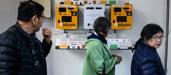 Pedestrians walk past ATM machines (L and R) for digital currency Bitcoin in Hong Kong on December 18, 2017 Pedestrians walk past ATM machines (L and R) for digital currency Bitcoin in Hong Kong on December 18, 2017 - Sputnik International