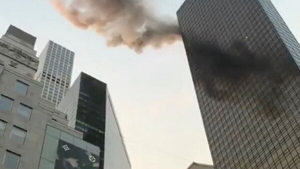 A smoke is seen rising from the roof of Trump Tower, in New York, U.S., January 8, 2018 in this still image obtained from social media video - Sputnik International