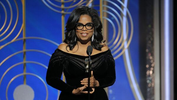 This image released by NBC shows Oprah Winfrey accepting the Cecil B. DeMille Award at the 75th Annual Golden Globe Awards in Beverly Hills, Calif., on Sunday, Jan. 7, 2018. - Sputnik International