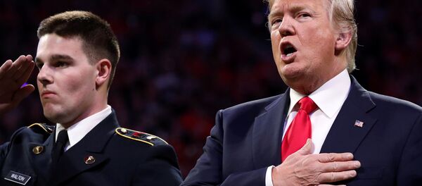 U.S. President Donald Trump sings along with the national anthem before the NCAA College Football Playoff Championship game between Alabama and Georgia in Atlanta, Georgia, U.S. January 8, 2018 U.S. President Donald Trump sings along with the national anthem before the NCAA College Football Playoff Championship game between Alabama and Georgia in Atlanta, Georgia, U.S. January 8, 2018 - Sputnik International