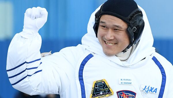 Member of the International Space Station (ISS) expedition 53/54, Norishige Kanai of the Japan Aerospace Exploration Agency (JAXA), waves during a send-off ceremony at the Russian-leased Baikonur Cosmodrome in Kazakhstan. (File) - Sputnik International