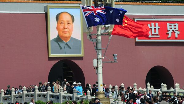 The national flags of Australia and China are displayed before a portrait of Mao Zedong facing Tiananmen Square, during a visit by Australia's Prime Minister Julia Gillard in Beijing on April 26, 2011 - Sputnik International