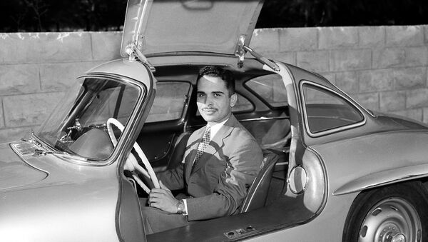 King Hussein of Jordan sits in his new Mercedes-Benz sports car at the Jordanian Royal Palace in Amman, Jordan, Oct. 30, 1957. The car is one of the latest models with gull-wing doors. - Sputnik International