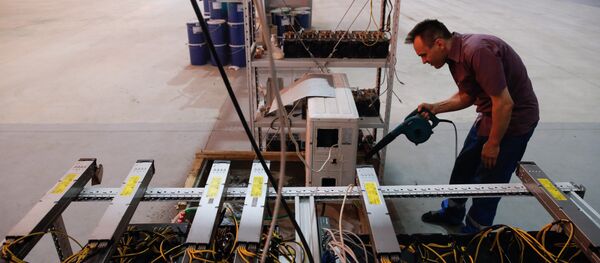 Russia's crypto-businessman Dmitry Marinichev's virtual currencies mining farm operates in a former Soviet-era car factory warehouse in Moscow, July 26, 2017 Russia's crypto-businessman Dmitry Marinichev's virtual currencies mining farm operates in a former Soviet-era car factory warehouse in Moscow, July 26, 2017 - Sputnik International