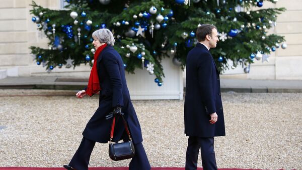 British Prime Minister Theresa May is welcomed by French President Emmanuel Macron before a lunch at the Elysee Palace in Paris, Tuesday, Dec. 12, 2017 - Sputnik International