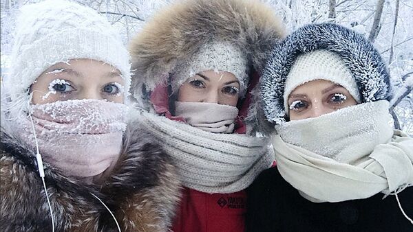 In this photo taken on Sunday, Jan. 14, 2018, Anastasia Gruzdeva, left, poses for selfie with her friends as the temperature dropped to about -50 degrees (-58 degrees Fahrenheit) in Yakutsk, Russia - Sputnik International