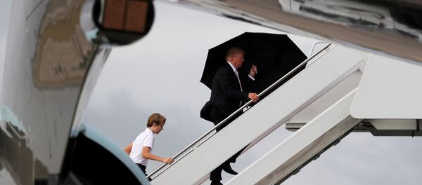 U.S. President Donald Trump and his son Barron board Air Force One as he departs West Palm Beach, Florida, U.S U.S. President Donald Trump and his son Barron board Air Force One as he departs West Palm Beach, Florida, U.S - Sputnik International