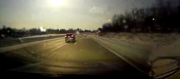 A car dash cam captures a view of a meteor near Bloomfield Hills, Michigan, U.S., January 16, 2018 in this still image from video obtained from social media A car dash cam captures a view of a meteor near Bloomfield Hills, Michigan, U.S., January 16, 2018 in this still image from video obtained from social media - Sputnik International