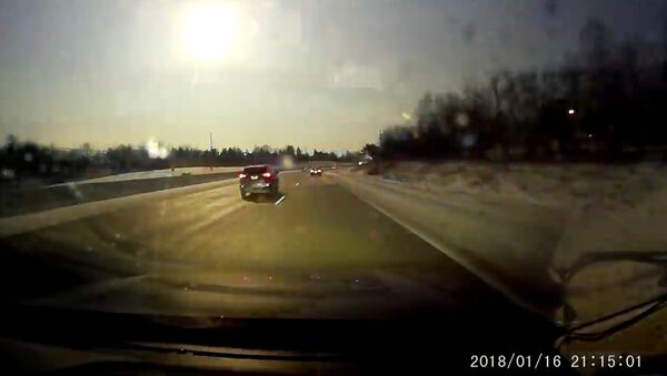A car dash cam captures a view of a meteor near Bloomfield Hills, Michigan, U.S., January 16, 2018 in this still image from video obtained from social media - Sputnik International